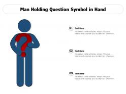 Man holding question symbol in hand