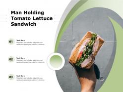 Man holding tomato lettuce sandwich