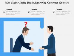 Man sitting inside booth answering customer question