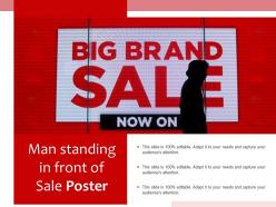 Man standing in front of sale poster
