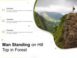 Man standing on hill top in forest