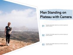 Man standing on plateau with camera