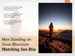 Man standing on snow mountain watching sun rise