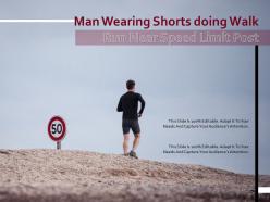 Man wearing shorts doing walk run near speed limit post