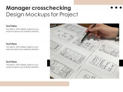Manager crosschecking design mockups for project