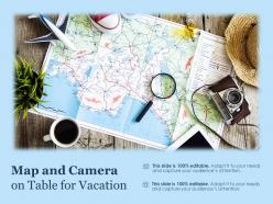 Map and camera on table for vacation
