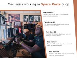 Mechanics working in spare parts shop