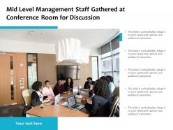 Mid level management staff gathered at conference room for discussion