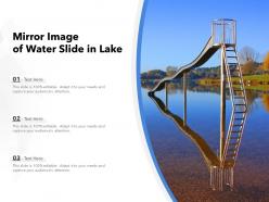 Mirror image of water slide in lake