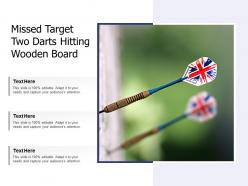 Missed target two darts hitting wooden board