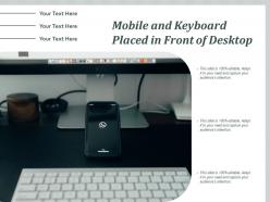 Mobile and keyboard placed in front of desktop