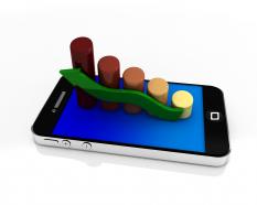 Mobile phone with bar graph and green arrow for growth stock photo