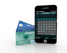 Mobile phone with two credit cards business stock photo