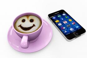 Mobile With Apps And Coffee Mug And Smiley Technology Stock Photo
