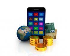 Mobile with gold coins and globe for business and technology stock photo