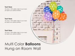 Multi color balloons hung on room wall