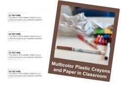 Multicolor plastic crayons and paper in classroom