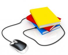 Multiple books with mouse and wire for technology stock photo