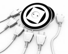 Multiple electrical white plugs with one socket business target stock photo