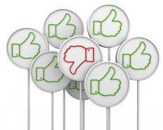 Multiple green likes with one red dislike hoarding stock photo