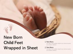 New born child feet wrapped in sheet