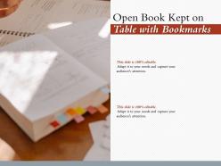Open book kept on table with bookmarks