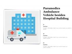 Paramedics ambulance vehicle besides hospital building