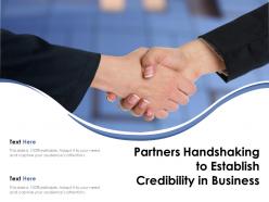 Partners handshaking to establish credibility in business