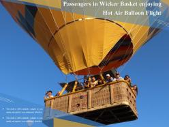 Passengers in wicker basket enjoying hot air balloon flight