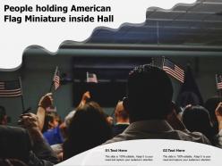 People holding american flag miniature inside hall