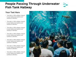 People Passing Through Underwater Fish Tank Hallway