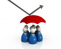 People under the umbrella and arrow showing safety stock photo