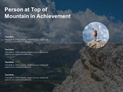 Person at top of mountain in achievement