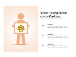 Person holding agreed icon on cardboard