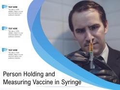 Person holding and measuring vaccine in syringe