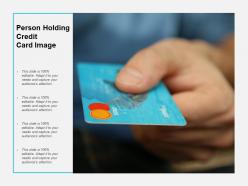 Person holding credit card image
