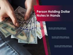 Person holding dollar notes in hands