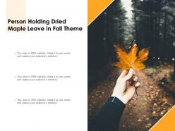 Person holding dried maple leave in fall theme