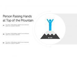 Person raising hands at top of the mountain