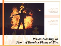 Person standing in front of burning flame of fire