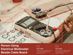 Person Using Electrical Multimeter Beside Cable Board