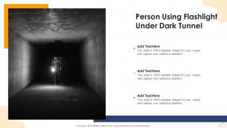 Person using flashlight under dark tunnel