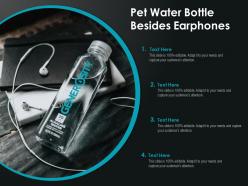 Pet water bottle besides earphones