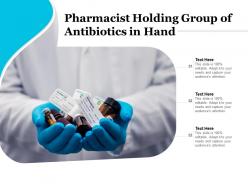Pharmacist holding group of antibiotics in hand