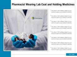 Pharmacist wearing lab coat and holding medicines