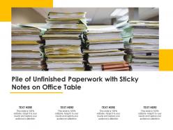 Pile of unfinished paperwork with sticky notes on office table