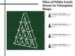 Piles of white cards house in triangular shape