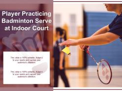 Player practicing badminton serve at indoor court