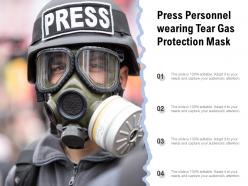 Press personnel wearing tear gas protection mask