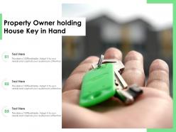 Property Owner Holding House Key In Hand
